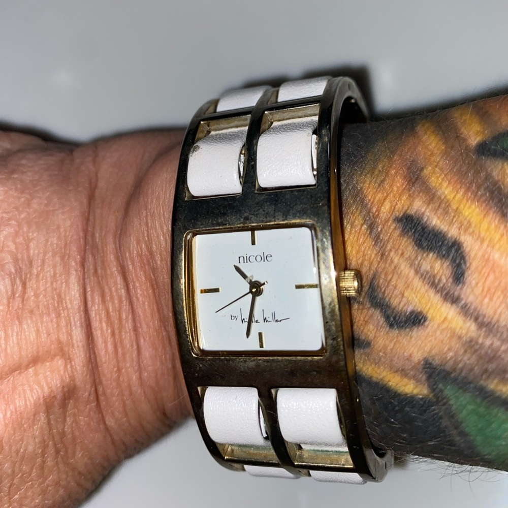 Vintage Nicole Miller Silvertone metal watch woven white leather band watch